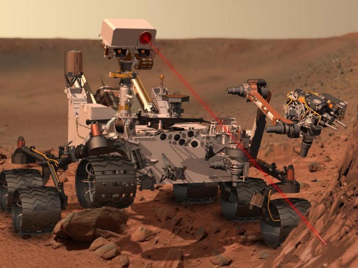 This artist's concept depicts the rover Curiosity, of NASA's Mars Science Laboratory mission, as it uses its Chemistry and Ca