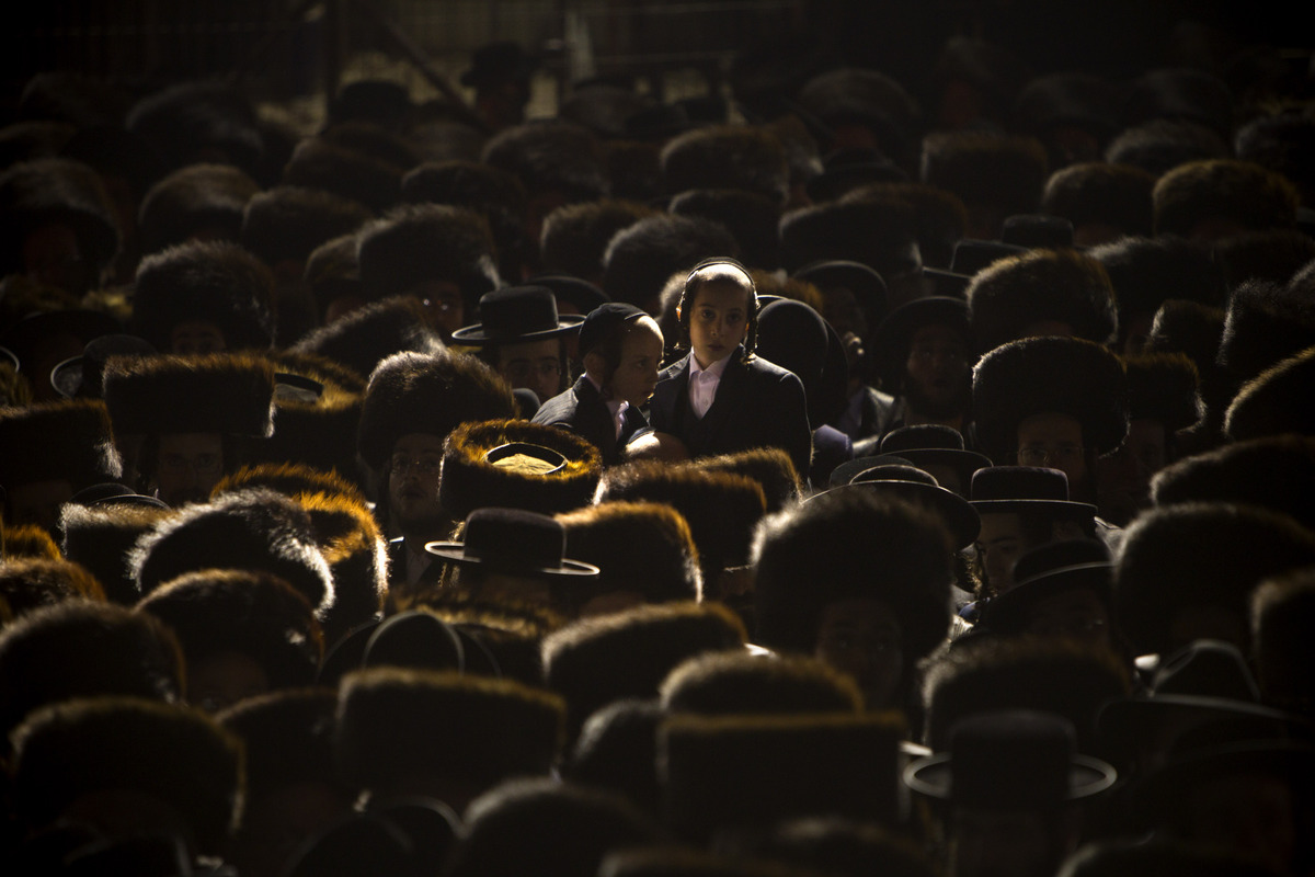 In this Wednesday, Jan. 23, 2013 photo, Ultra-Orthodox Jews gather for traditional Jewish wedding of the granddaughter of Sat