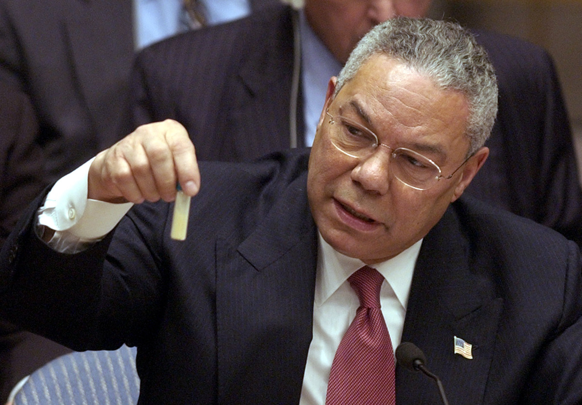 U.S. Secertary of State Colin Powel holds up a vial that he said could contain anthrax during a meeting of the United Nations