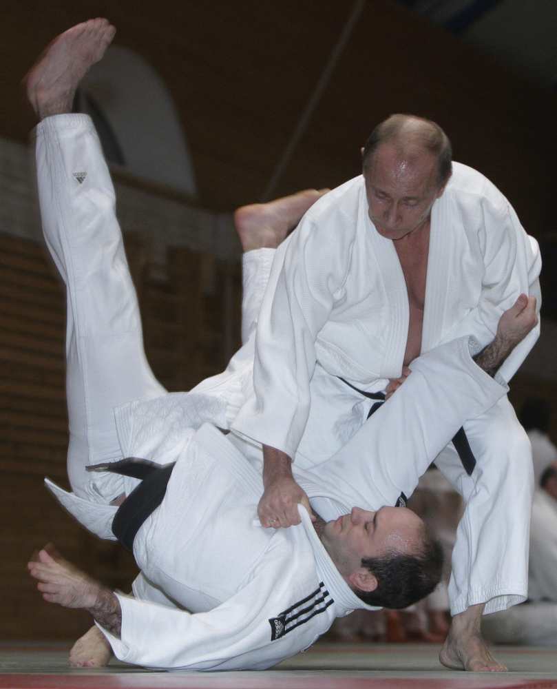 In this Friday, Dec. 18, 2009 file photo, then Russian prime minister Vladimir Putin, right, is seen during judo training at 