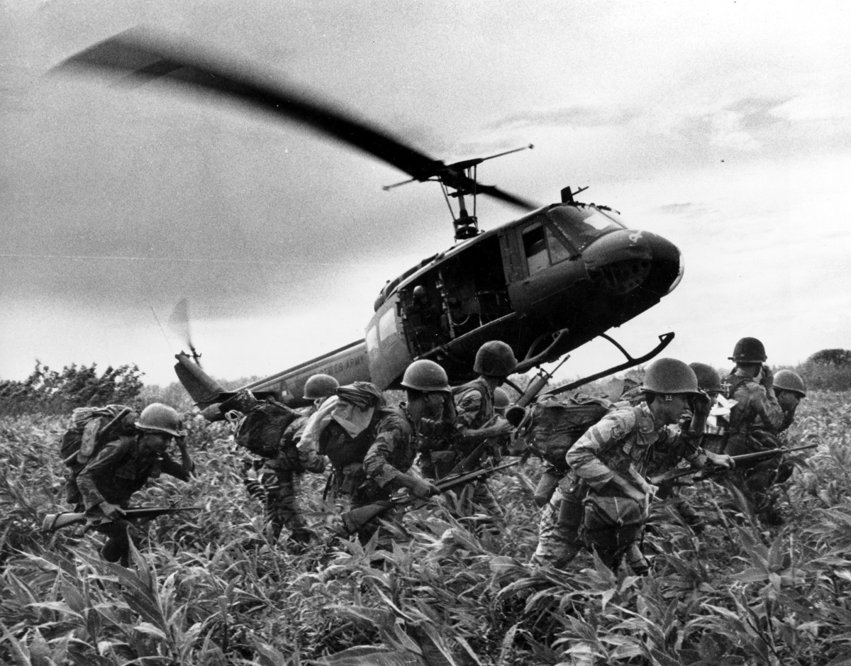 In this June 1970 file photo, taken by Associated Press photographer Huynh Cong "Nick" Ut, south Vietnamese Marines rush to t