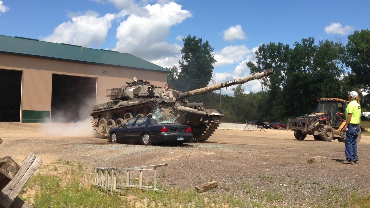 David Lohr's son Alex crushing a car at Drive A Tank in Kasota, Minnesota.