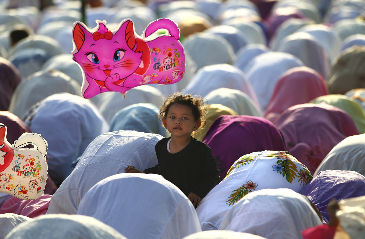 Eid Al-Adha 2013: Muslims Observe The Feast Of Sacrifice 