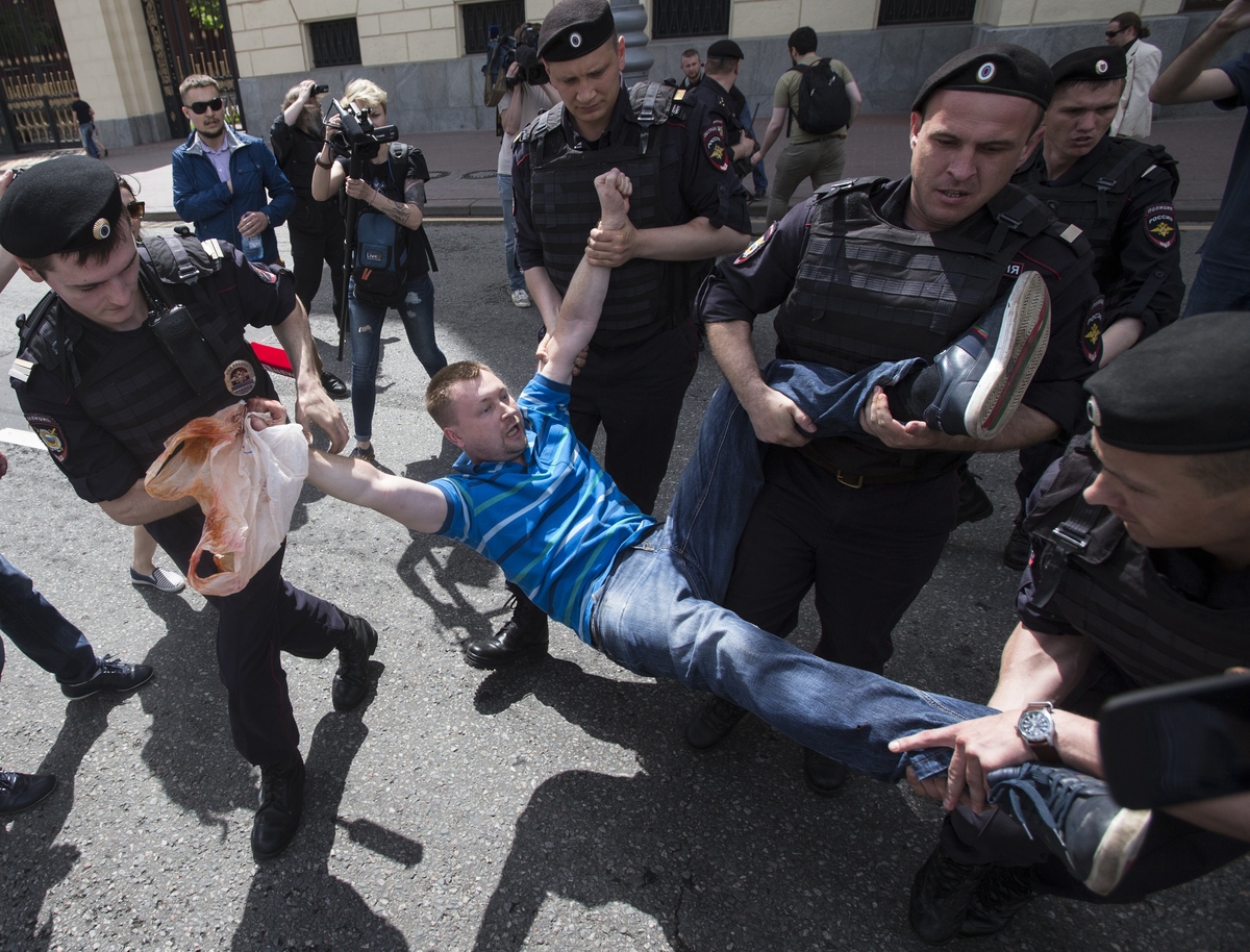 Russian police officers detain gay rights activist Nikolai Alexeyev during an attempt to hold a gay demonstration in Moscow, 
