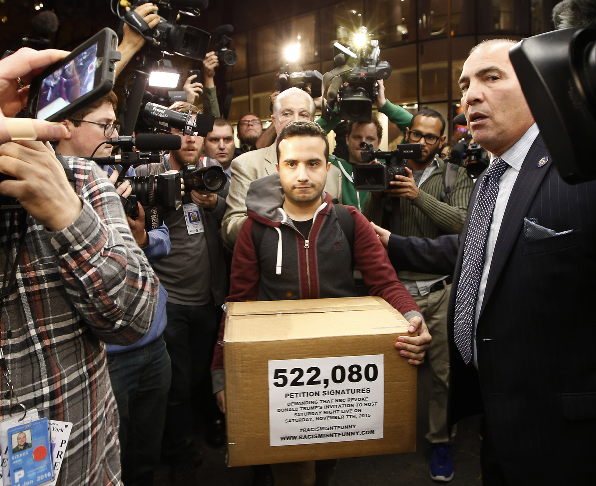 Juan Escalante, campaign manager for the immigration reform group America's Voice, carries a box he claims contains over half