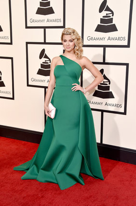 The asymmetrical neckline on this emerald green gown is to die for.