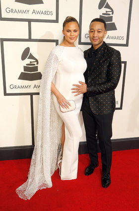 It could be the mother-to-be glow, but Chrissy looks absolutely radiant in this white cape, and John cleans up nicely in Gucci.