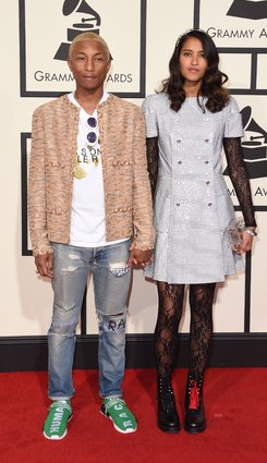 We can always count on Pharrell and wife Helen Lasichanh to bring an effortlessly cool vibe to the red carpet, and they did not disappoint with their Grammys looks. We're especially loving Pharrell's Chanel tweed jacket. 