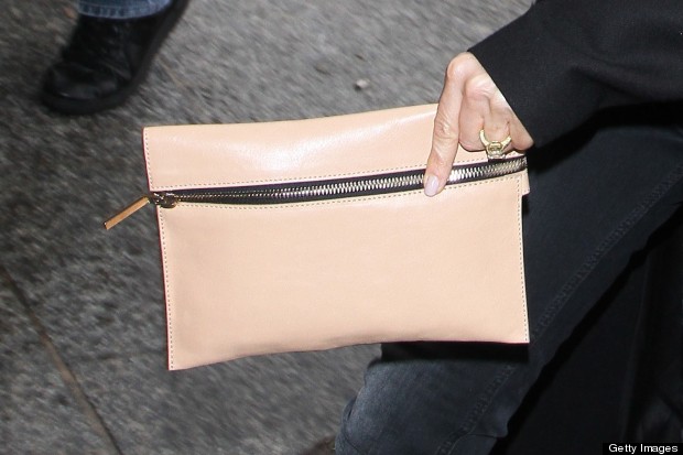Victoria Beckham Arrives Back In London Makes A Clutch Bag Look Either Way Victoria Reminded Us That There S Nothing Quite Like A Clutch Bag To Make An Outfit Look Chic Particularly If It In Peach Leather And Has