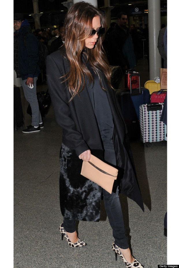 Victoria Beckham Arrives Back In London Makes A Clutch Bag Look Victoria Beckham Arrives Back In London Makes A Clutch Bag Look Practical
