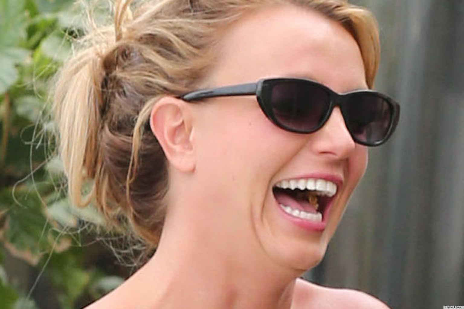 Britney Spears Steps Out Without A Bra Struggles To Keep Her Dress From Falling Down Photos