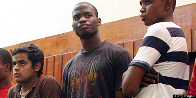 Adebolajo (centre) of Romford, Essex, has been remanded in custody