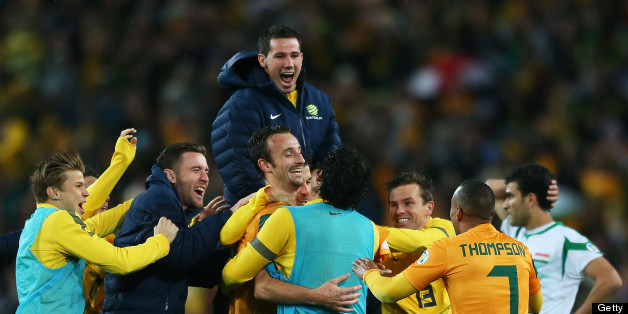 Joshua Kennedy is mobbed by teammates