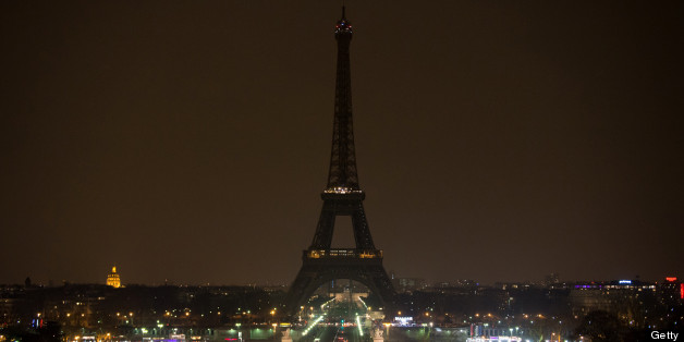 The Eiffel Tower is seen before plunging into darkness at 8:30 p.m. (local time) as part of the Earth Hour switch-off on March 23, 2013, in Paris. (BERTRAND LANGLOIS/AFP/Getty Images)