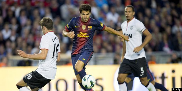 Cesc Fabregas (C) of Barcelona vies for the ball with Michael Carrick (L) and Rio Ferdinand (R) of Manchester during the friendly football match between Barcelona FC and Manchester United at Ullevi Stadium in Gothenburg on August 8, 2012. AFP PHOTO / SCANPIX-SWEDEN / BJORN LARSSON ROSVALL ***SWEDEN OUT*** (Photo credit should read BJORN LARSSON ROSVALL/AFP/GettyImages)