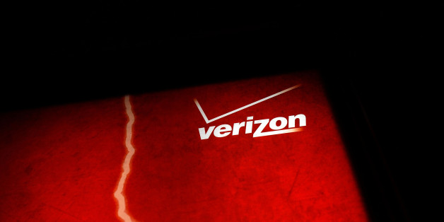 NEW YORK, NY - JUNE 07: A Verizon advertisement sits outside of a store on June 7, 2013 in New York City. In a statement today U.S. President Barack Obama defended the government's surveillance programs following a news leak on June 5 that the U.S. government had been obtaining Verizon's phone records for years. The records were obtained through a secret court order which also revealed that the government has been monitoring business phone calls both nationally and internationally. (Photo by Spencer Platt/Getty Images)