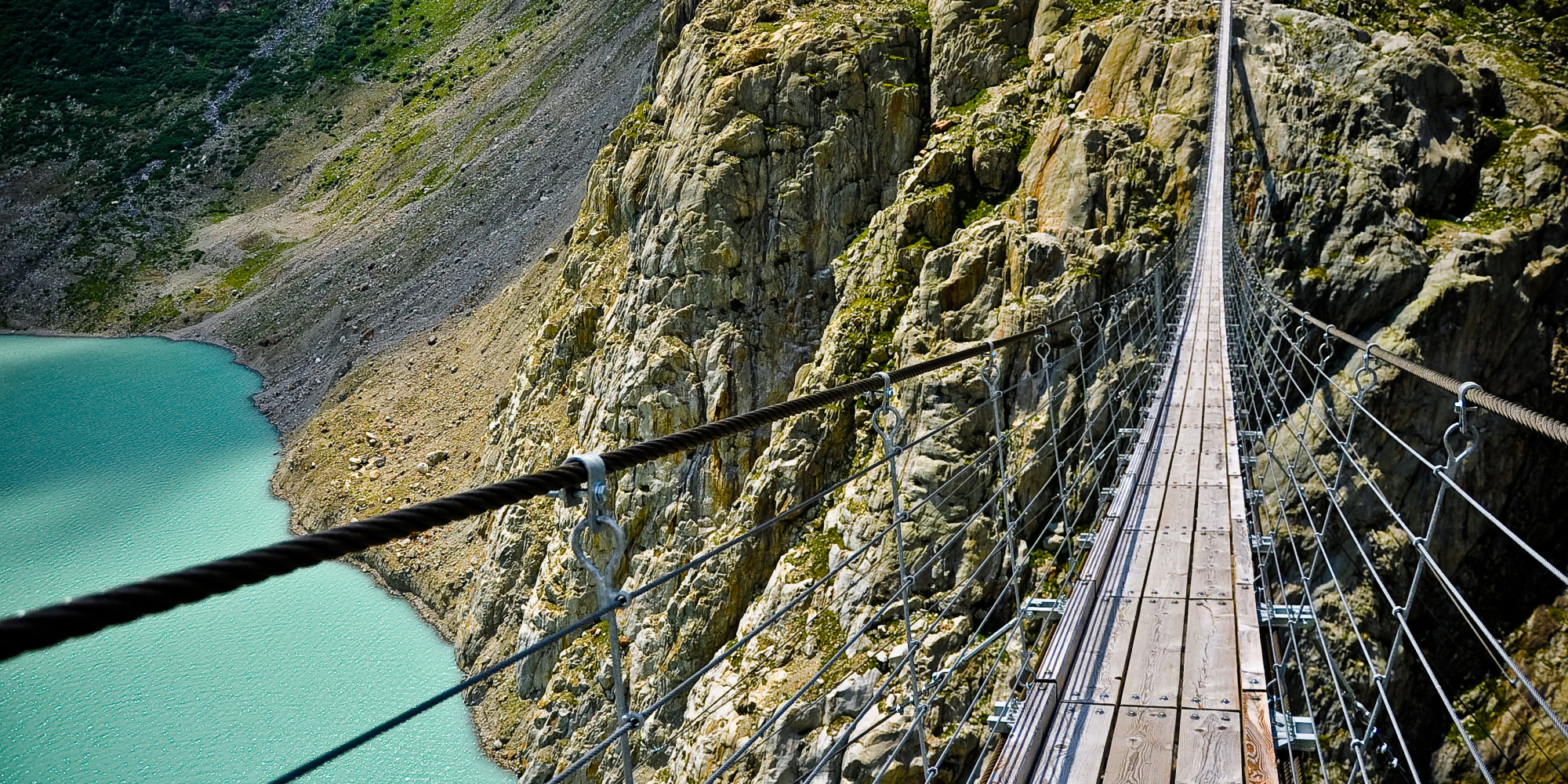 10 Terrifying Bridges You Need to See to Believe | HuffPost : An amazing image depicting a stunning landscape. Its colors are just striking and mix ideally. The composition is fantastic, and its details are also very defined.