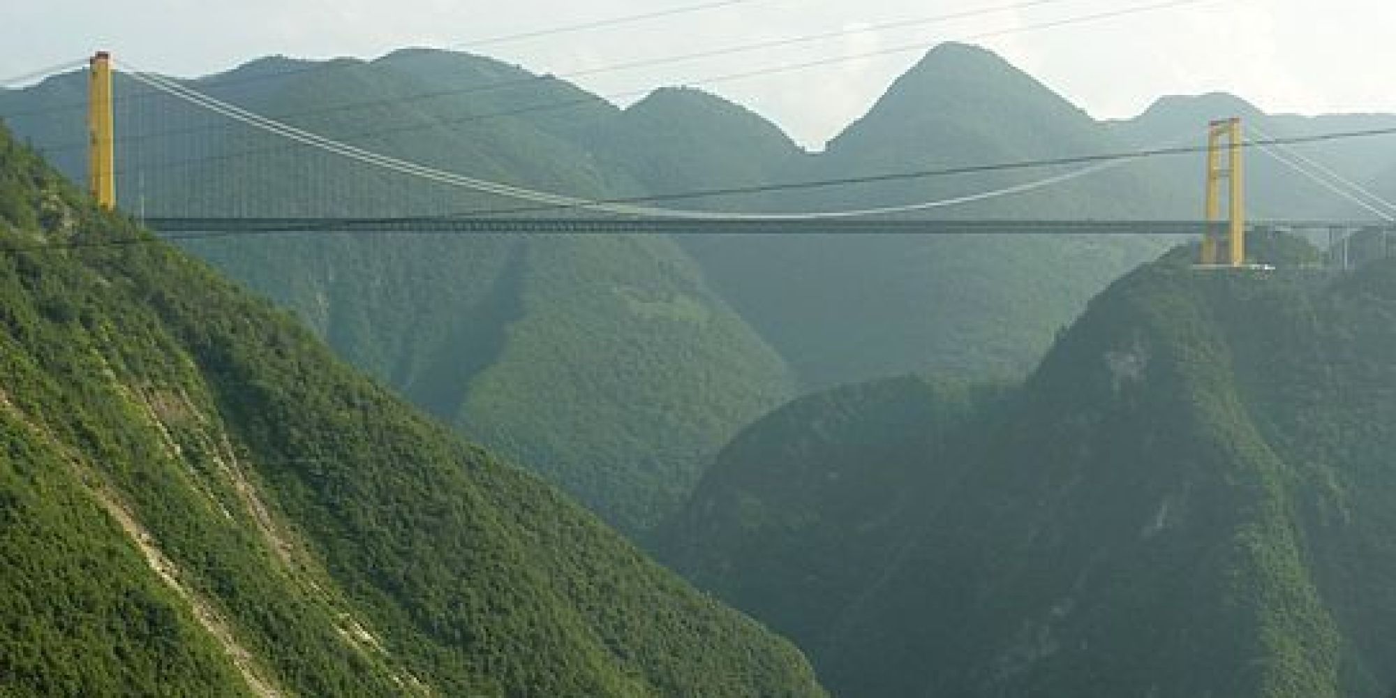 World's Most Terrifying Bridges (PHOTOS) - Weather.com | HuffPost : A astonishing image depicting a stunning scenery. The hues are just bold and mix flawlessly. Its arrangement looks wonderful, with the details are highly defined.