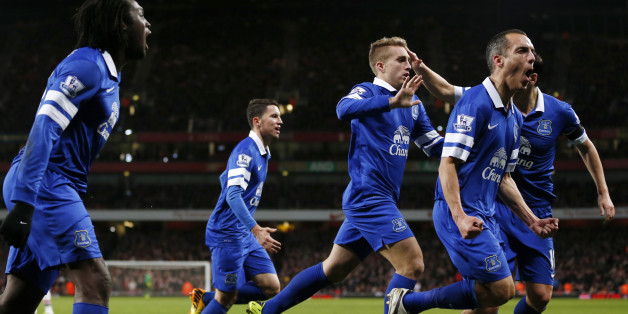 Everton players celebrate after Everton's Spanish striker Gerard Deulofeu (C) scored an equaliser during the English Premier League football match between Arsenal and Everton at The Emirates Stadium in north London on December 8, 2013. The match ended in a 1-1 draw. AFP PHOTO/ADRIAN DENNIS
== RESTRICTED TO EDITORIAL USE. NO USE WITH UNAUTHORIZED AUDIO, VIDEO, DATA, FIXTURE LISTS, CLUB/LEAGUE LOGOS OR LIVE SERVICES. ONLINE IN-MATCH USE LIMITED TO 45 IMAGES, NO VIDEO EMULATION. NO USE IN BETTING, GAMES OR SINGLE CLUB/LEAGUE/PLAYER PUBLICATIONS == (Photo credit should read ADRIAN DENNIS/AFP/Getty Images)