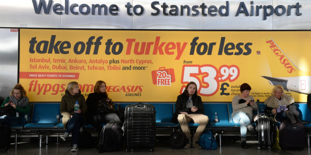 Passengers wait at Stansted Airport, Essex, after a "technical problem" at the National Air Traffic Services (Nats) control centre in Swanwick, Hampshire, caused delays at airports across the UK.