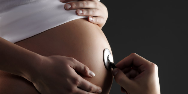 an isolated shot of a pregnant...
