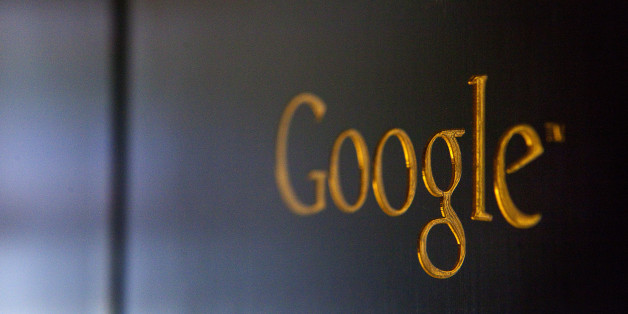 A gold colored Google Inc. logo sits on a sign outside the company's offices in Berlin, Germany, on Friday, Aug. 16, 2013. Google, based in Mountain View, California, is seeking to revive Motorola Mobility's smartphone business, recently announcing a new flagship Moto X smartphone with customizable colors that will be assembled in the U.S. Photographer: Krisztian Bocsi/Bloomberg via Getty Images