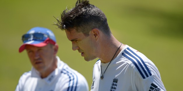 England Ashes Test cricketer Kevin Pietersen (R) speaks with coach Andy Flower (L) during a training session at a suburban cricket ground near Perth on October 29, 2013. Australia will be fighting to win back the Ashes for the first time in six years but injuries, selection woes and a questionable build-up give every sign of a team in upheaval ahead of the first Test against England at the Gabba in Brisbane starting November 21. AFP PHOTO / Greg WOODIMAGE STRICTLY RESTRICTED TO EDITORIAL USE -