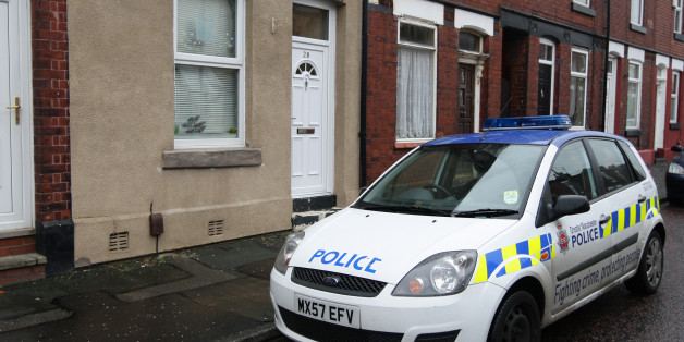 A police car outside the home of Victorino Chua, in Stockport. The 46-year-old male nurse is suspected of murdering three hospital patients at Stepping Hill Hospital in Cheshire and has been released on police bail pending further inquiries.