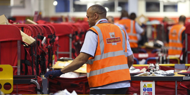 A Royal Mail Plc employee sorts parcels into red delivery destination trolleys at the company's Mount Pleasant postal sorting office in London, U.K., on Tuesday, Feb. 11, 2014. Royal Mail, the U.K. postal service that sold shares in an initial public offering last year, said like-for-like sales gained 2 percent in the first nine months of the year boosted by parcel deliveries. Photographer: Chris Ratcliffe/Bloomberg via Getty Images