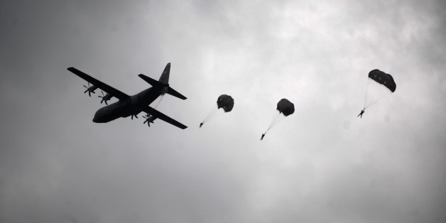 A US army soldiers of the second Squadron 28th Cavalry Regiment (2-38th) part of the NATO-led peacekeeping mission in Kosovo jump with parachutes during a US military drill near the town of Gjakova on May 12, 2014. AFP PHOTO / ARMEND NIMANI (Photo credit should read ARMEND NIMANI/AFP/Getty Images)