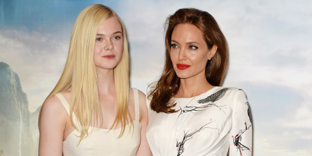 LONDON, ENGLAND - MAY 09: (EMBARGOED FOR PUBLICATION IN UK TABLOID NEWSPAPERS UNTIL 48 HOURS AFTER CREATE DATE AND TIME. MANDATORY CREDIT PHOTO BY DAVE M. BENETT/WIREIMAGE REQUIRED) Elle Fanning (L) and Angelina Jolie pose at a photocall for 'Maleficent' at the Corinthia Hotel London on May 9, 2014 in London, England. (Photo by Dave M. Benett/WireImage)