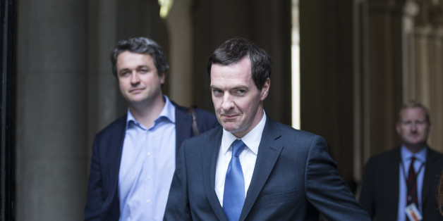 LONDON, ENGLAND - JULY 15: George Osborne (C), the Chancellor of the Exchequer, arrives in Downing Street on July 15, 2014 in London, England. British Prime Minister David Cameron is conducting a reshuffle of his Cabinet team with a greater number of women expected to be appointed to senior positions. (Photo by Oli Scarff/Getty Images)