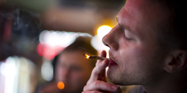 AMSTERDAM, NETHERLANDS - NOVEMBER 01: Jay, 29 years old from London, smokes cannabis in a coffee shop on November 1, 2012 in the center of Amsterdam, Netherlands. Coffee shops in the Dutch captial will remain open to tourists after its mayor, Eberhard van der Laan, decided that tourists will not be banned from the 220 coffee shops in Amsterdam where marijuana and hashish are openly sold and consumed. The decision came after the new government of the Netherlands stated that it would be up to local authorities to decide whether or not to impose a ban on cannabis. (Photo by Jasper Juinen/Getty Images)