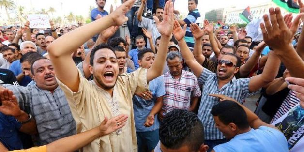 Manifestation à Tripoli le 31 juillet 2014 de Libyens réclamant une intervention de la communauté internationale pour assurer la protection des civils en Libye. (AFP)
