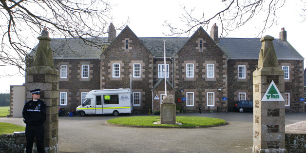 JERSEY, UNITED KINGDOM - FEBRUARY 24: A Jersey police officer stands outside Haute de la Garenne where the remains of a child's body have been found during an investigation into child abuse dating back to the 1960s, at Haute de la Garenne youth hostel in St.Martin, on February 24, 2008 in Jersey, Channel Islands. Jersey police began to investigate abuse allegations in November lat year, and have not ruled out the possibilty of finding more bodies as their search continues. (Photo by Christian