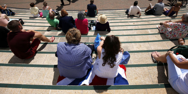 Fans on Murray mount soak up the sun during day three of the Wimbledon Championships at the All England Lawn Tennis and Croquet Club, Wimbledon.