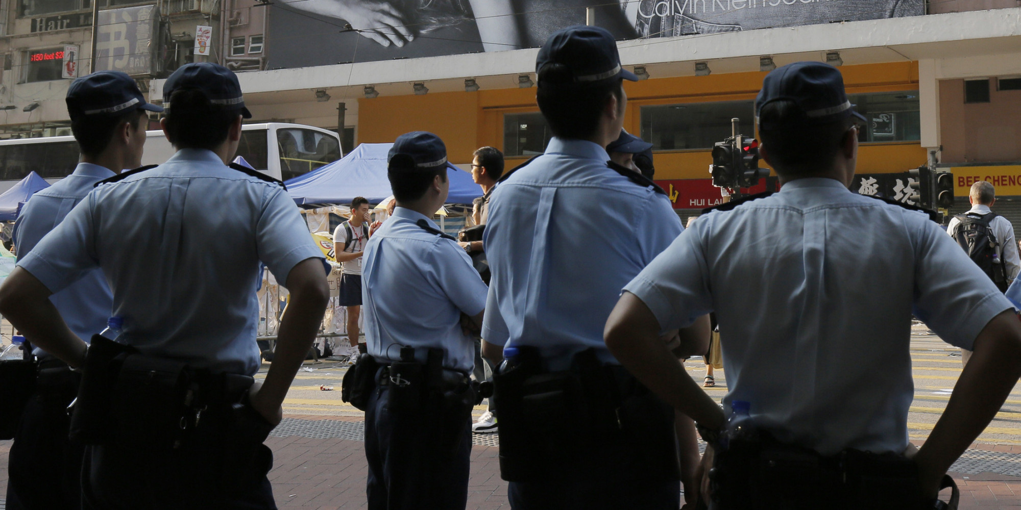 Hong Kong Police Officers Suspended After Allegedly Beating Pro