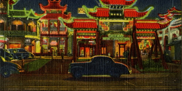 UNITED STATES - CIRCA 1943: Postcard view of Chinatown at night showing the building lit by neon. Vintage automobiles are on the street. (Photo by Lake County Museum/Getty Images)