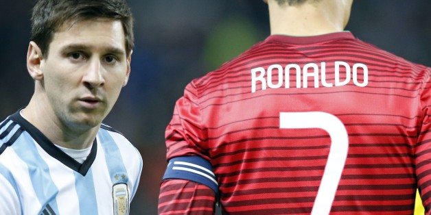 Lionel Messi of Argentina, left, stands next to Cristiano Ronaldo of Portugal before their International Friendly soccer match at Old Trafford Stadium, Manchester, England, Tuesday Nov. 18, 2014. (AP Photo/Jon Super)