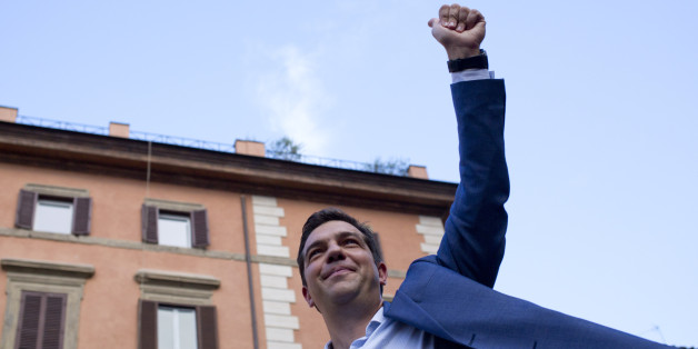 Leader of the left-wing Syriza party Alexis Tsipras,waves at the end of a rally in Rome, Friday, July 18, 2014. (AP Photo/Alessandra Tarantino)