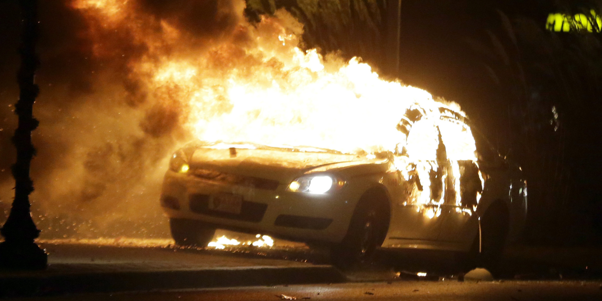 ferguson smolders after night of fires unrest following grand jury