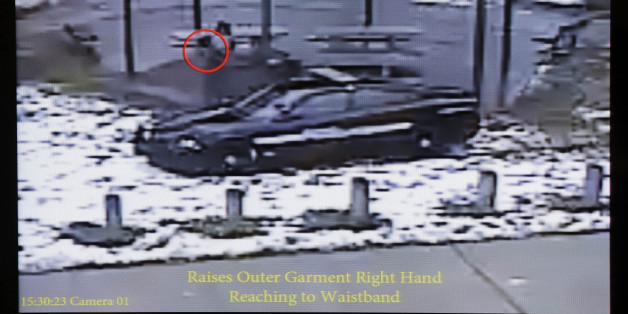 This still image taken from a surveillance video played at a news conference held by Cleveland Police, Wednesday, Nov. 26, 2014, shows Cleveland police officers arriving at Cudell Park on a report of a man with a gun. Twelve-year-old Tamir Rice was fatally shot by a Cleveland police officer Saturday, Nov. 22, 2014, after he reportedly pulled a replica gun at the city park. (AP Photo/Mark Duncan)