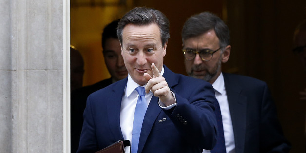 Britain's Prime Minister David Cameron points towards the media as he leaves 10 Downing Street in London, Thursday, Nov. 20, 2014. David Cameron will attend a Liaison Committee Thursday, the meeting focuses on the Governance of the UK in the light of the Scottish Referendum. (AP Photo/Kirsty Wigglesworth)