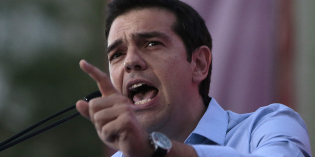 Greece's Left-wing opposition leader Alexis Tsipras addresses his party's supporters during a rally outside Parliament demanding elections, in Athens on Monday June 17, 2013. Exactly one year ago, Greeceâs conservative prime minister won the mandate to form a coalition government with a daunting brief: Restart punishing reforms, keep the debt-stifled country in the eurozone and end months of political chaos. The latter has proved harder, and Antonis Samaras is now making a last-ditch bid to quell a revolt by key allies over his decision to close the countryâs state TV and radio broadcaster, axing nearly 2,700 jobs to meet austerity targets. (AP Photo/Dimitri Messinis)