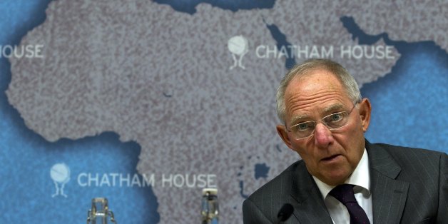 Dr Wolfgang Schäuble, Germany's Federal Minister of Finance, looks up while making a speech entitled 'Achieving Sustainable Growth: Fiscal Consolidation and Financial Market Regulation' at Chatham House, in London, on October 17, 2011. Dr Schäuble argued that governments in and beyond the eurozone need not just commit to fiscal consolidation and improved competitiveness, they need to start delivering on these objectives with immediate effect. AFP PHOTO / ADRIAN DENNIS (Photo credit should read ADRIAN DENNIS/AFP/Getty Images)