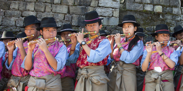 Exile Tibetan students of the Tibetan Children's Village School perform a traditional tune during the 54th Founding Anniversary celebrations of their school in Dharmsala, India, Thursday, Oct. 23, 2014. The school, which started as an orphanage in 1960, houses and educates over 2000 refugee children. (AP Photo/Ashwini Bhatia)
