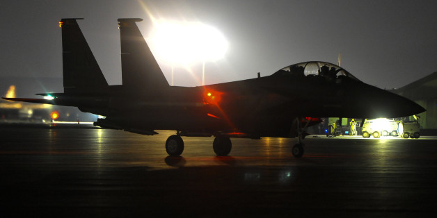 CORRECTS TYPE OF AIRCRAFT In this Sept. 23, 2014 photo provided by the U.S Air Force, a F-15 strike Eagle taxis in the U.S. Central Command area of responsibility prior to strike operations in Syria. U.S. coalition-led warplanes struck Islamic State group militants near the northern Syrian town of Kobani, also known as Ayn Arab, near the Turkish border for the first time Saturday, Sept. 27, 2014, activists and a Kurdish official said. The coalition, which began its aerial campaign against Islamic State fighters in Syria early Tuesday, aims to roll back and ultimately crush the extremist group, which has created a proto-state spanning the Syria-Iraq border. (AP Photo/U.S. Air Force, Russ Scalf)
