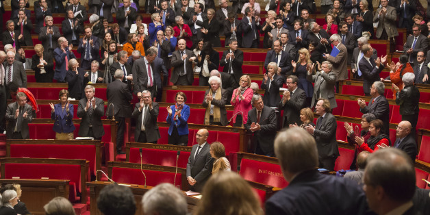 Members of French parliament, applaud after the vote for the recognition of the Palestinian State in Paris, Tuesday, Dec. 2, 2014, as opposition members leave the hall in foreground. Franceâs lower house of Parliament has voted to urge the government to recognize a Palestinian state, in the hope that speeds up peace efforts after decades of conflict. Tuesdayâs French vote, approved with 339 votes to 151, is non-binding. (AP Photo/Michel Euler)