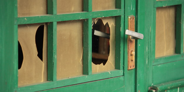 Broken glass in a door of a barn
