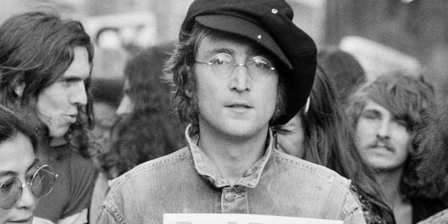 Portrait of British musician John Lennon (1940 - 1980) (center) and his wife, artist and musician Yoko Ono (extreme left) as they attend an unspecified rally in Hyde Park, London, England, 1975. (Photo by Rowland Scherman/Getty Images)